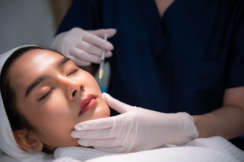 young Asian woman making cosmetology treatment skin injection, Mesotherapy of face beauty care